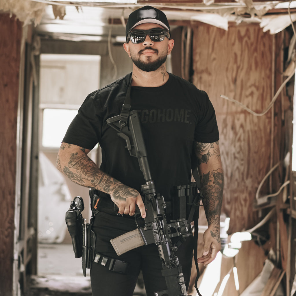 WE GO HOME FORGED IN ADVERSITY T-SHIRT - MURDERED