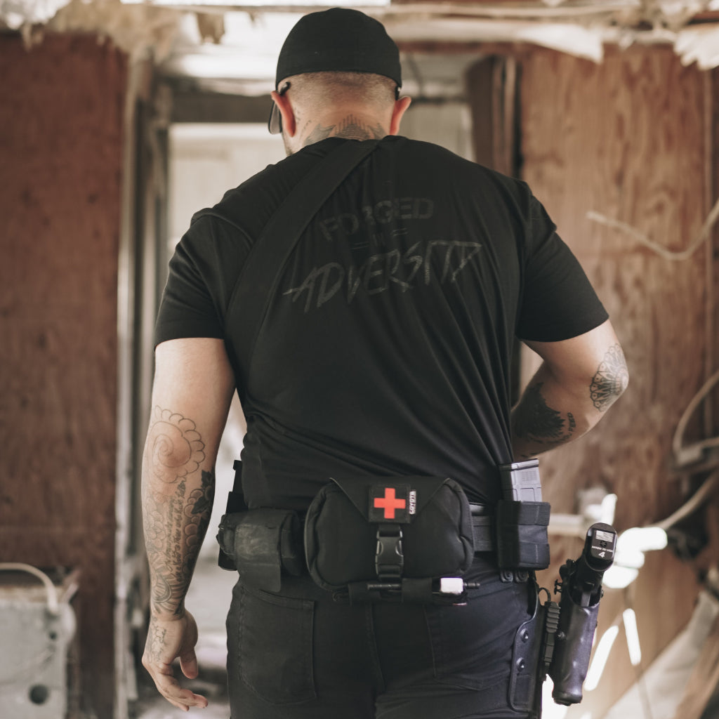 WE GO HOME FORGED IN ADVERSITY T-SHIRT - MURDERED
